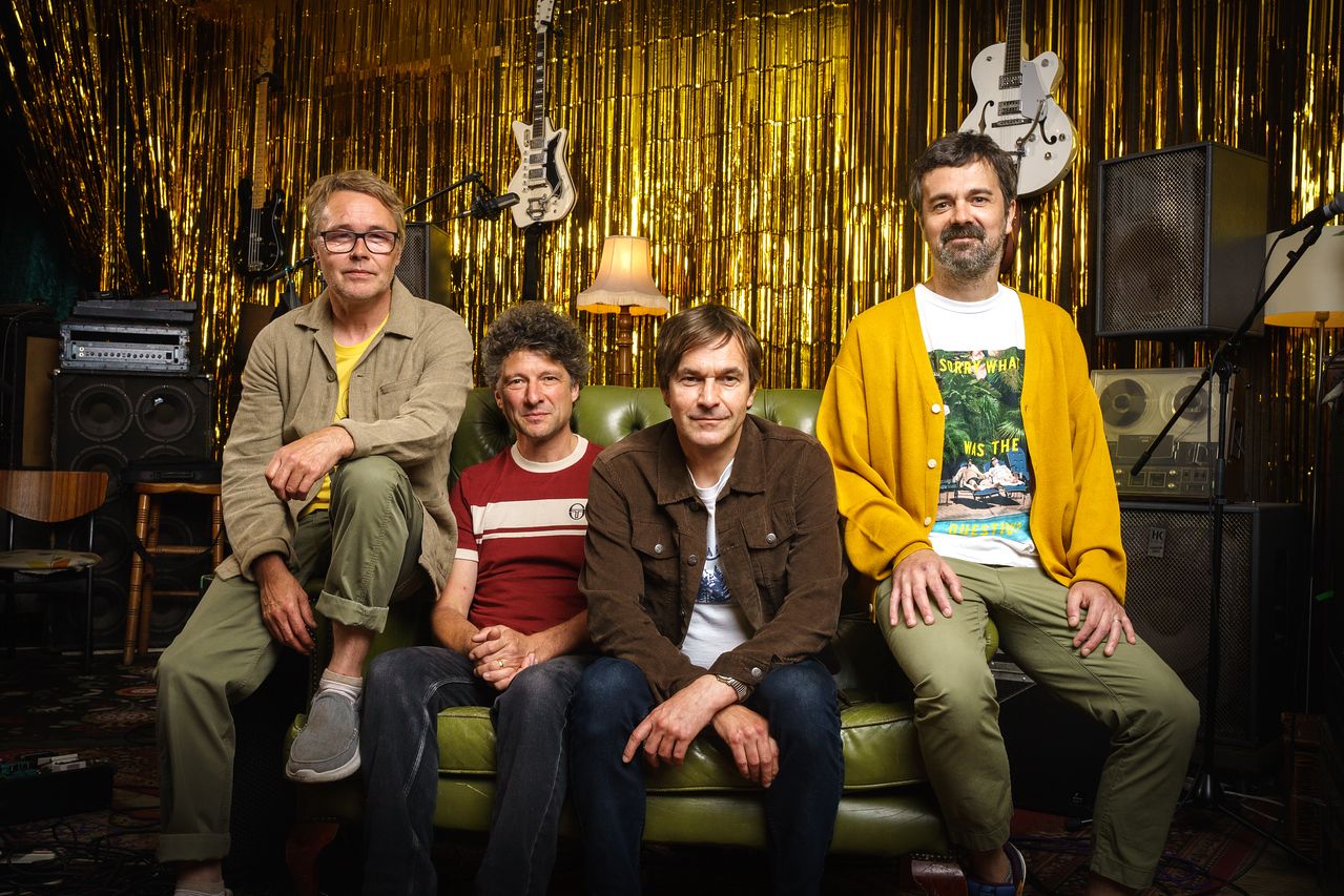 The Bluetones band portrait in a gold studio